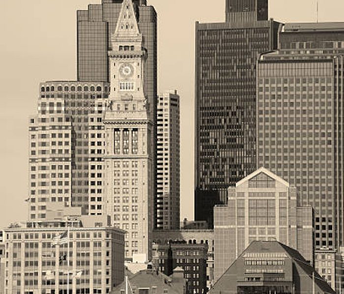 Boston downtown architecture closeup in black and white over sea.